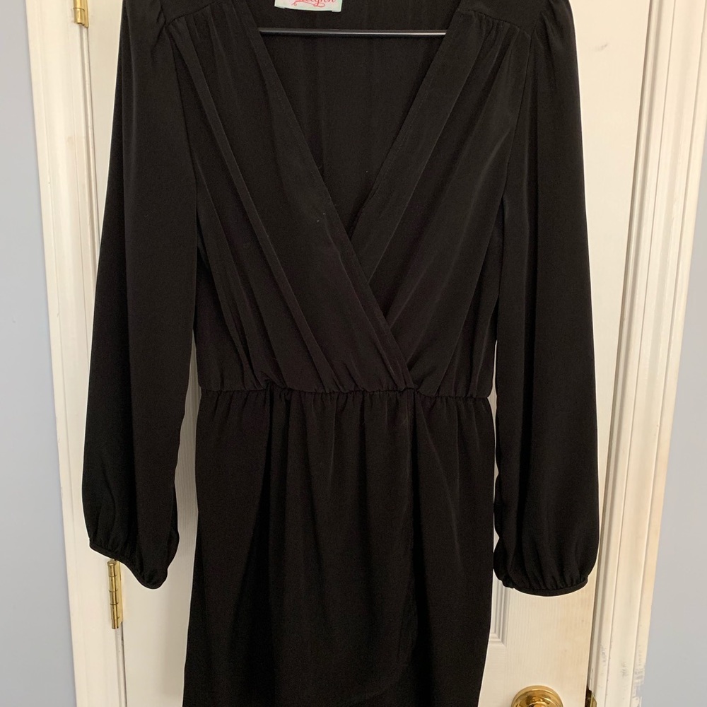 Black above the knee dress. Low cut v neck.